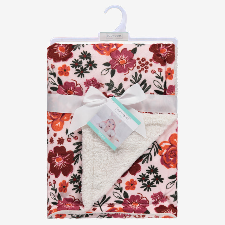 Baby blanket rosey floral shown for retail with blanket